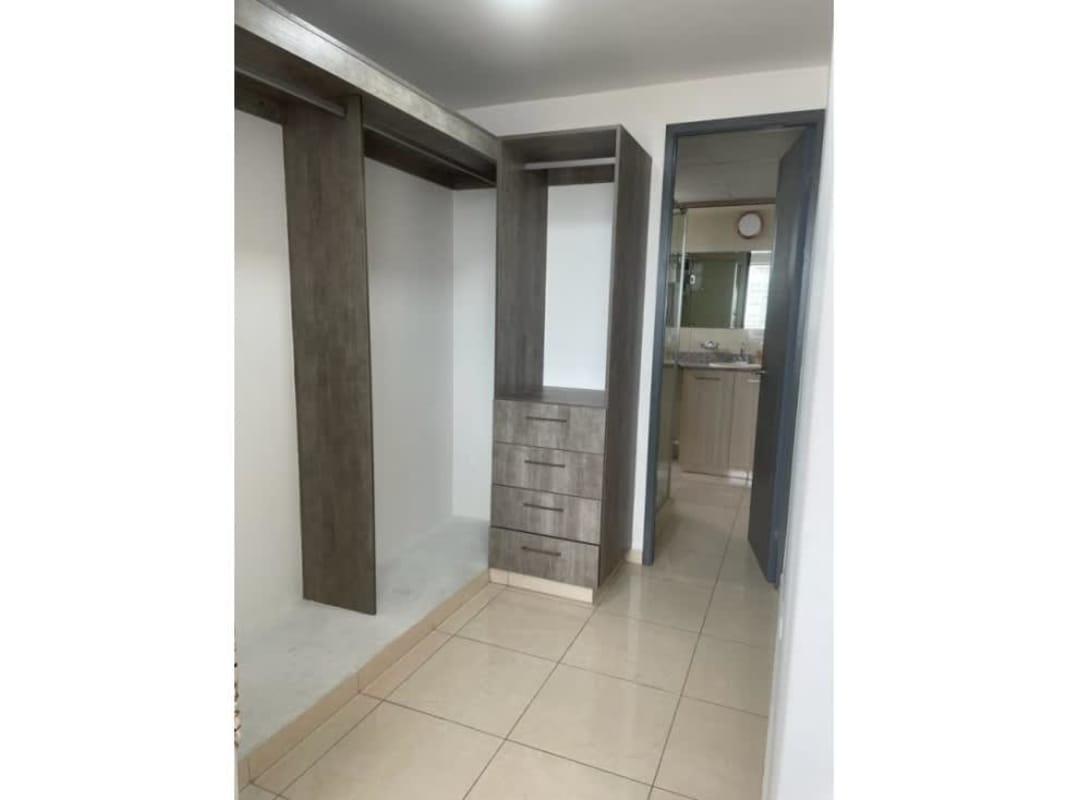 Spacious closet with built-in cabinetry near bathroom PH Sabana Tower Hato Pintado Panama