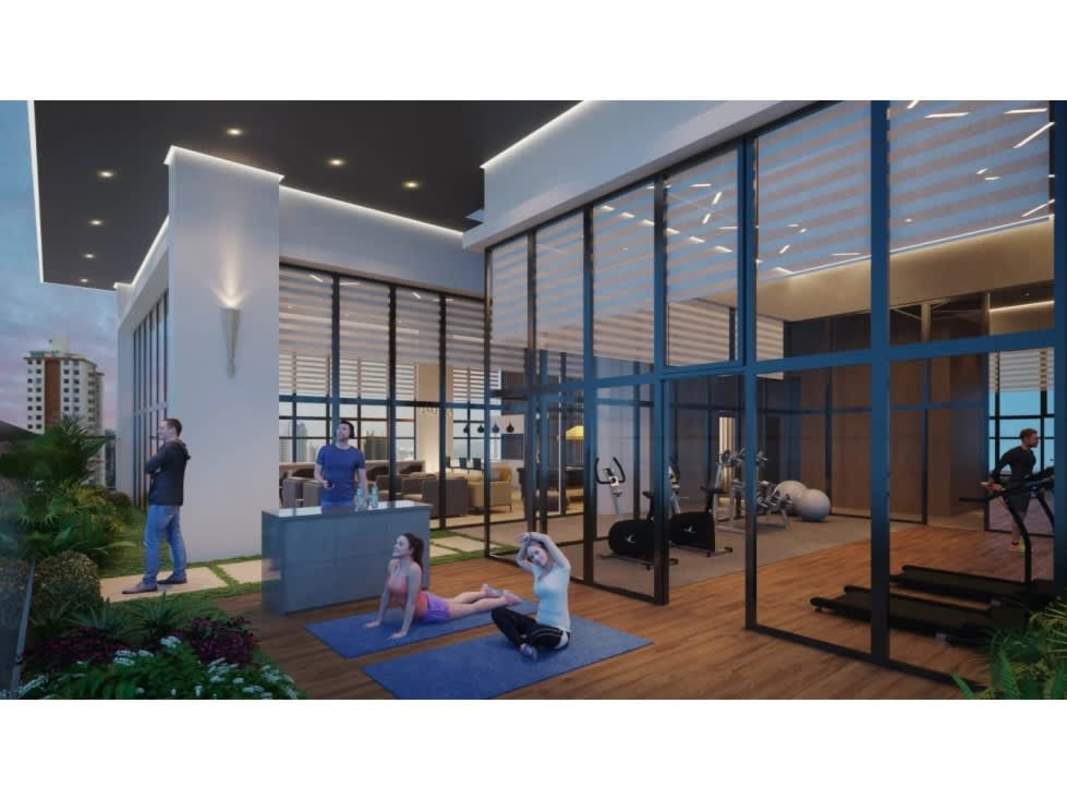 Open plan living and kitchen area with large windows in PH Aura Obarrio Panama