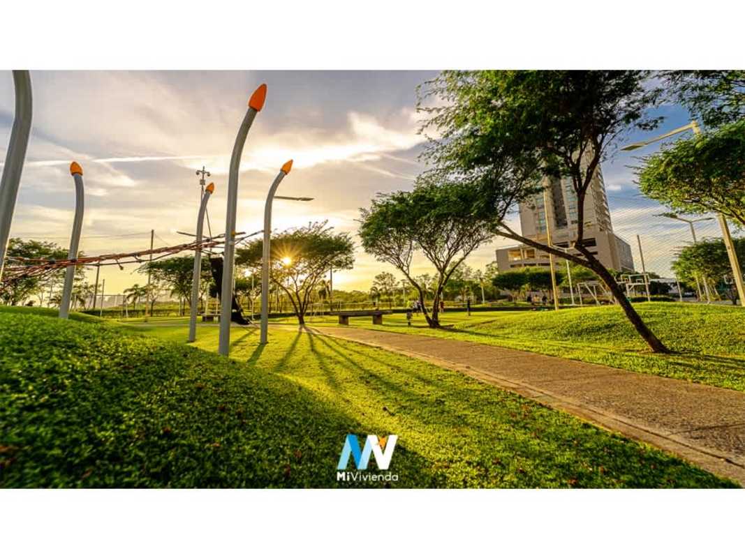 Sunset over green lawns, playground, high-rise background Costa del Este Panama