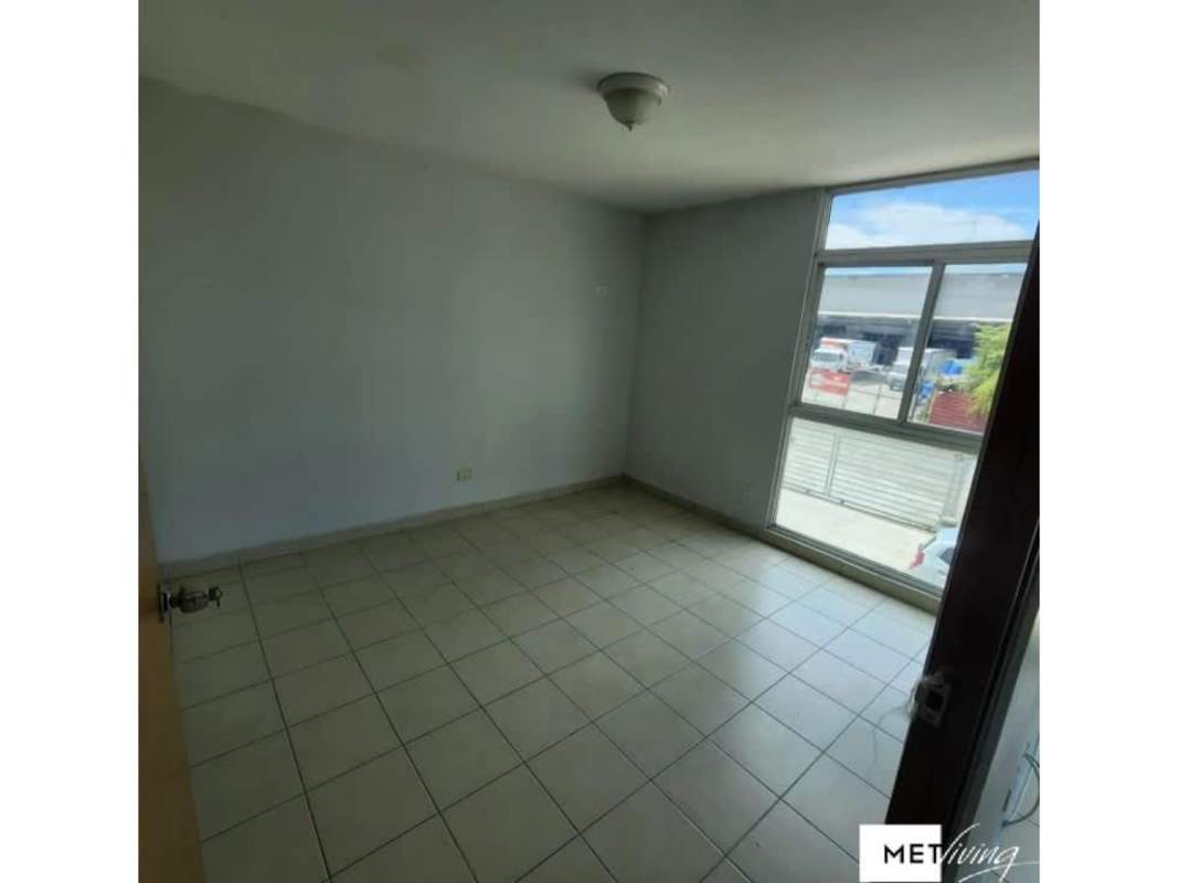 Living and dining space with large window inside Villa Lucre apartment