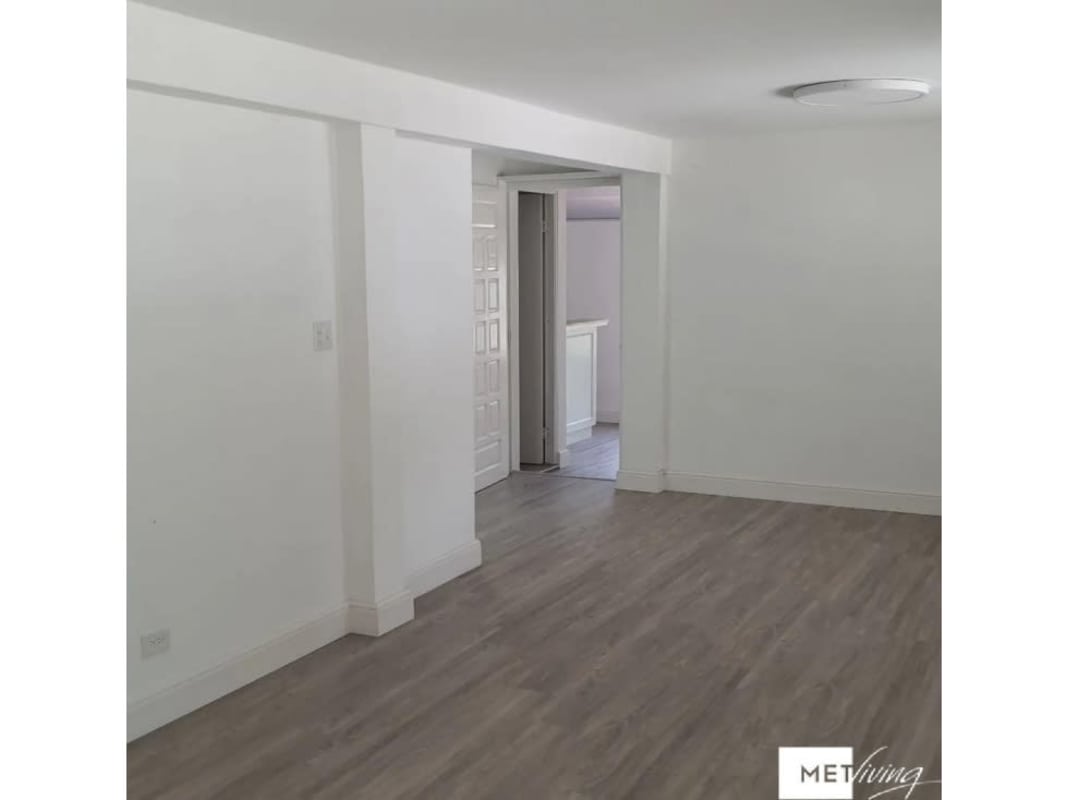 Modern commercial house bathroom with tiled walls and pedestal sink San Francisco Panama