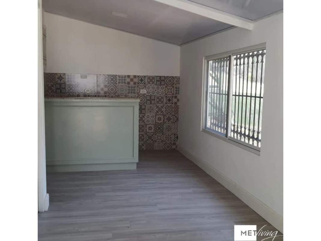 Kitchen with mint green cabinets, granite counters, patterned tile backsplash San Francisco Panama rental