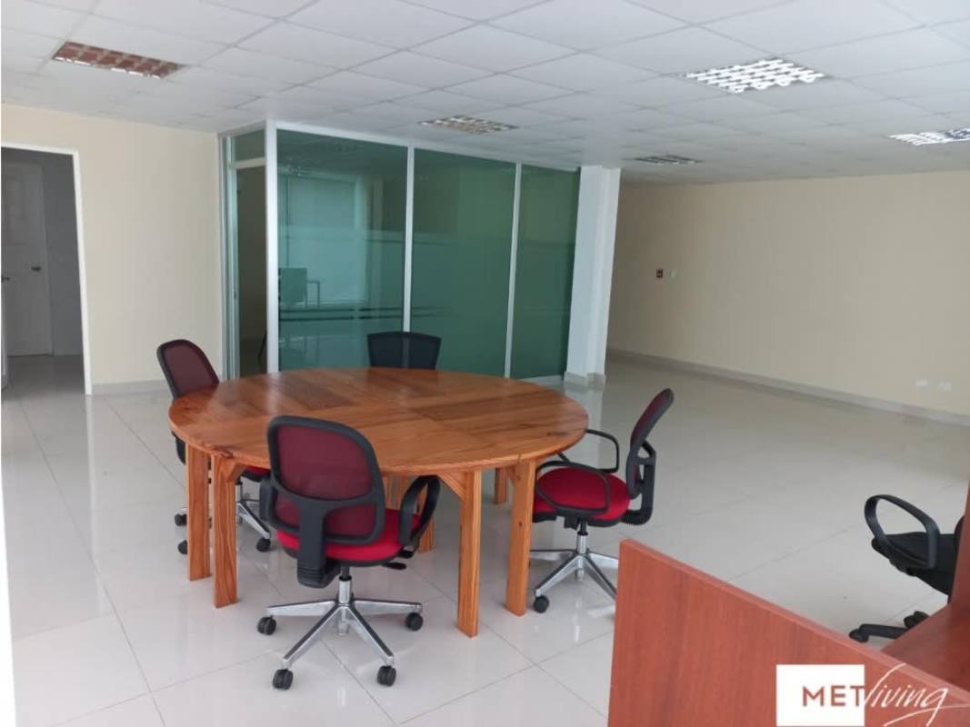 Open-plan office workspace with glass partitions, tiled flooring, modern lighting in PH Plaza El Cangrejo Bella Vista Panama