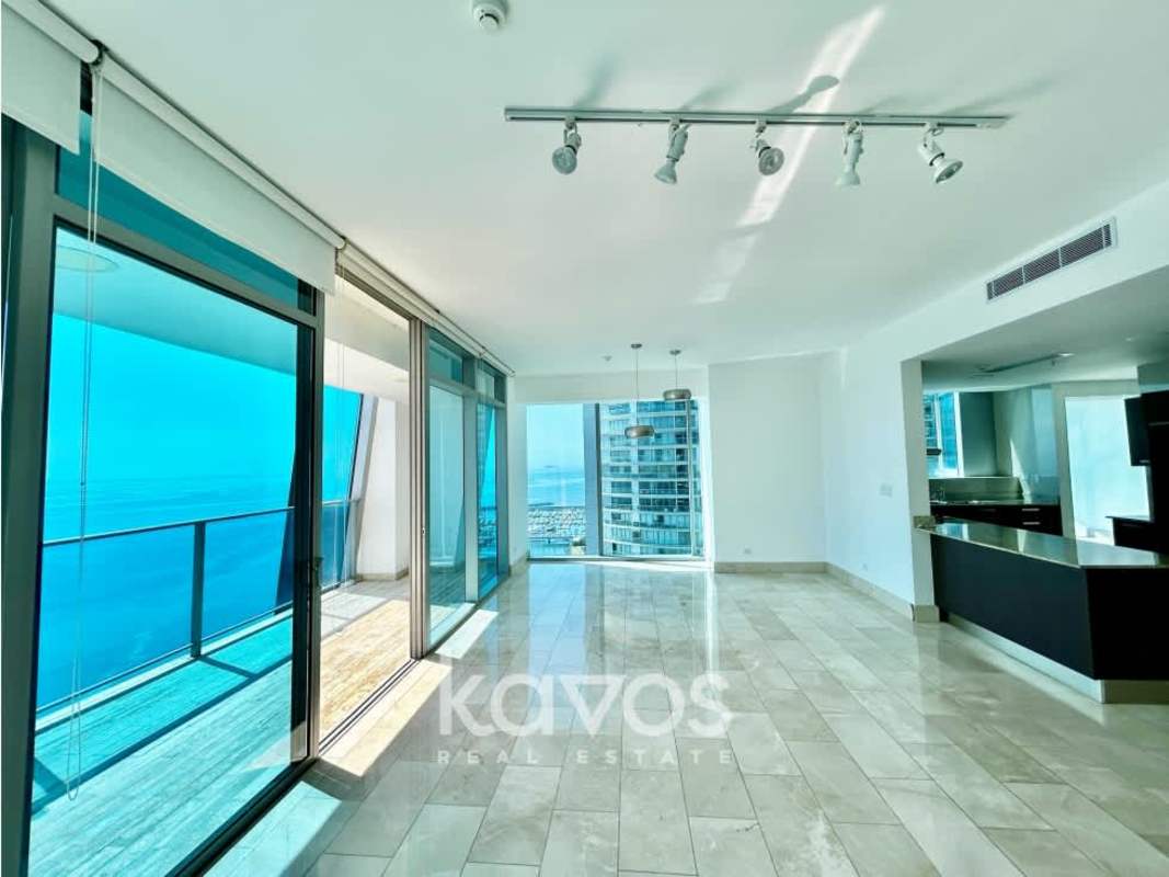 Unfurnished bedroom with panoramic sea views through large glass windows in PH Grand Tower