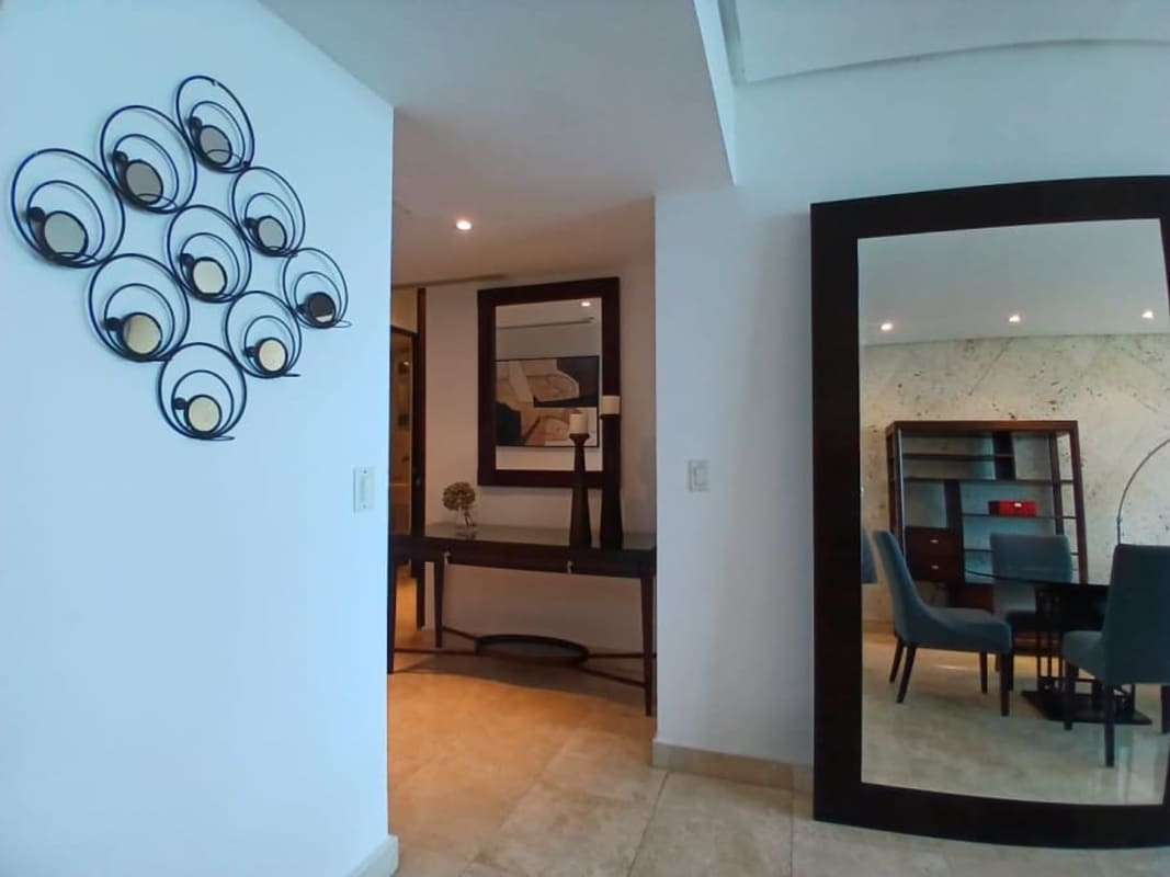 Open concept living and dining room with ocean views and access to balcony PH BICSA Financial Center Panama