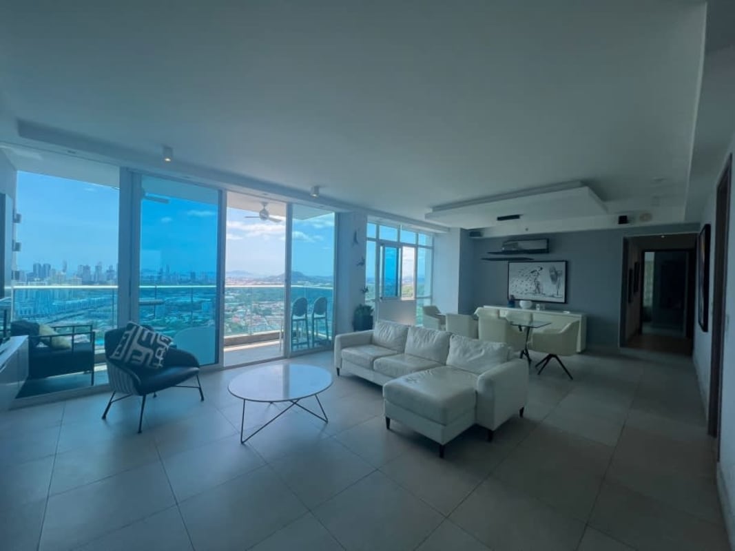 Living dining with floor-to-ceiling windows, city view in Dos Mares Panama