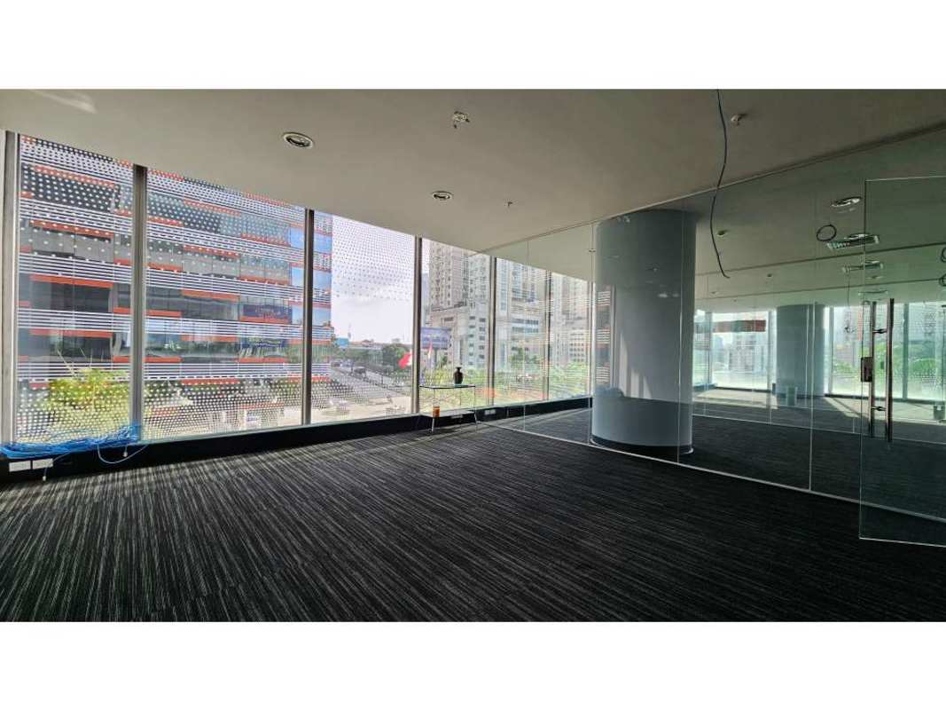 Large modern office floor with panoramic floor-to-ceiling windows at Oceania Business Plaza