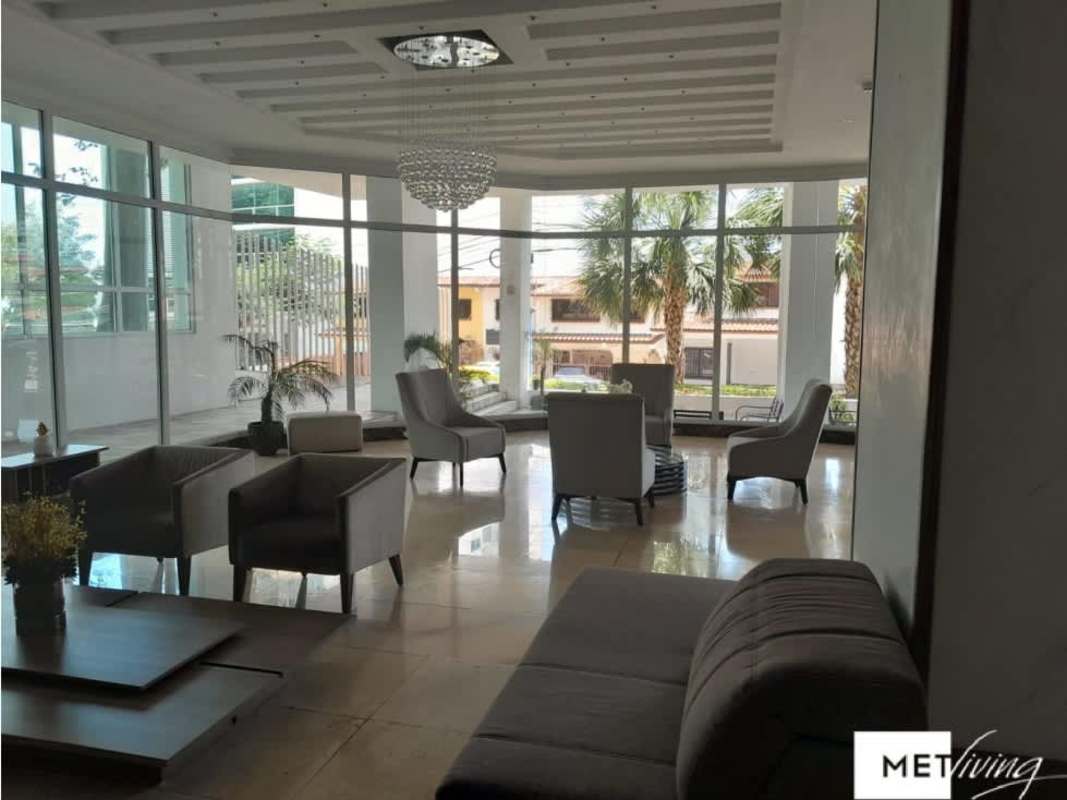 Foresta Tower modern lobby with chandelier, glass windows, and comfortable seating Panama City