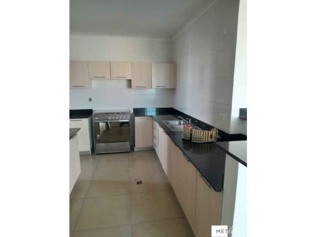 Kitchen with granite countertop, beige cabinetry, stainless steel appliances in Foresta Tower Panama
