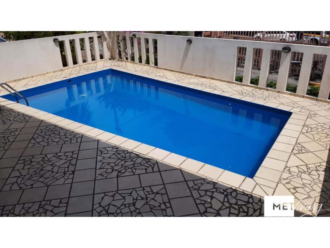 Swimming pool with deck and white railing in PH Hato Pintado Panama