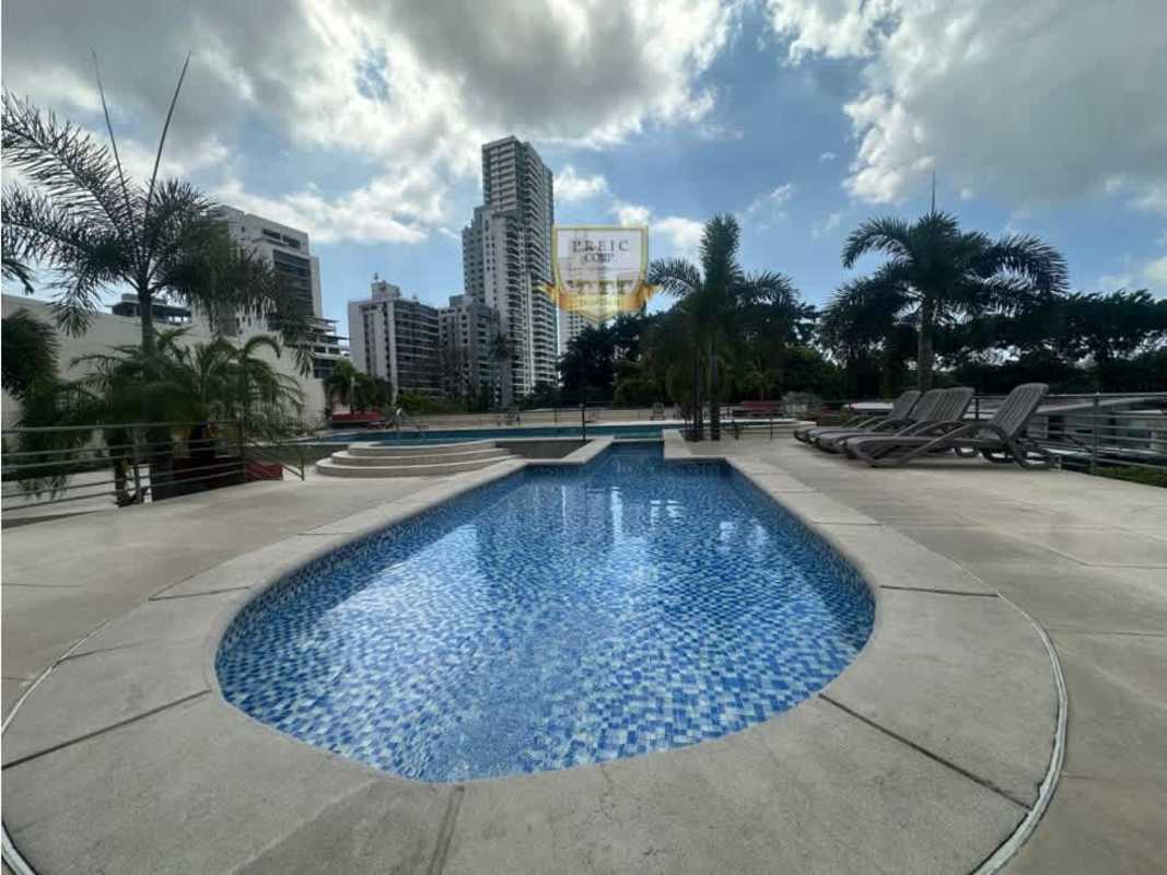 Outdoor pool deck with lounge chairs city skyline PH Sky Park Carrasquilla