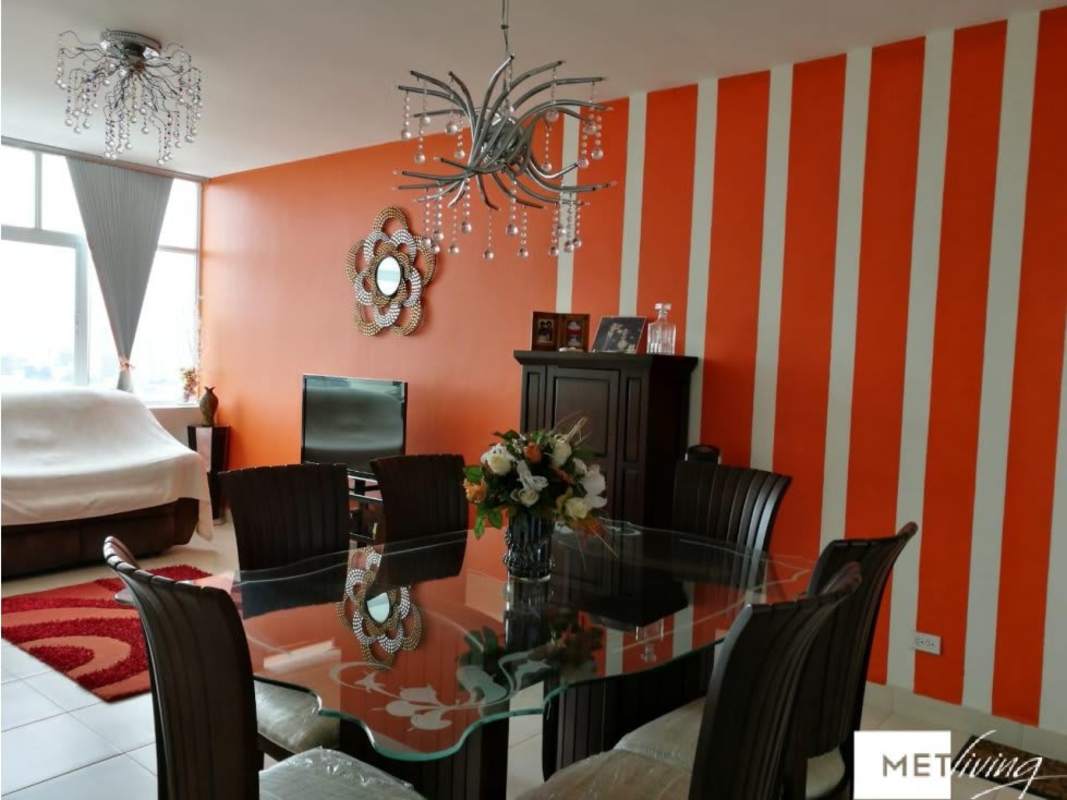 Modern open concept living dining area with accent wall Edison Park Panama apartment