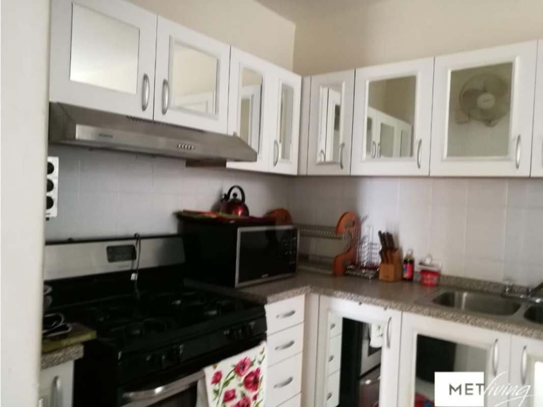 Bedroom featuring storage bed, vertical blinds, AC Edison Park Panama apartment