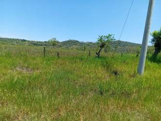 Open grassy land with countryside and hillside views in Chiriquí Panama