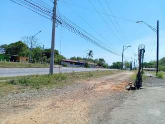 Unfinished commercial spaces with open yard and truck parking in Las Lomas David Panama