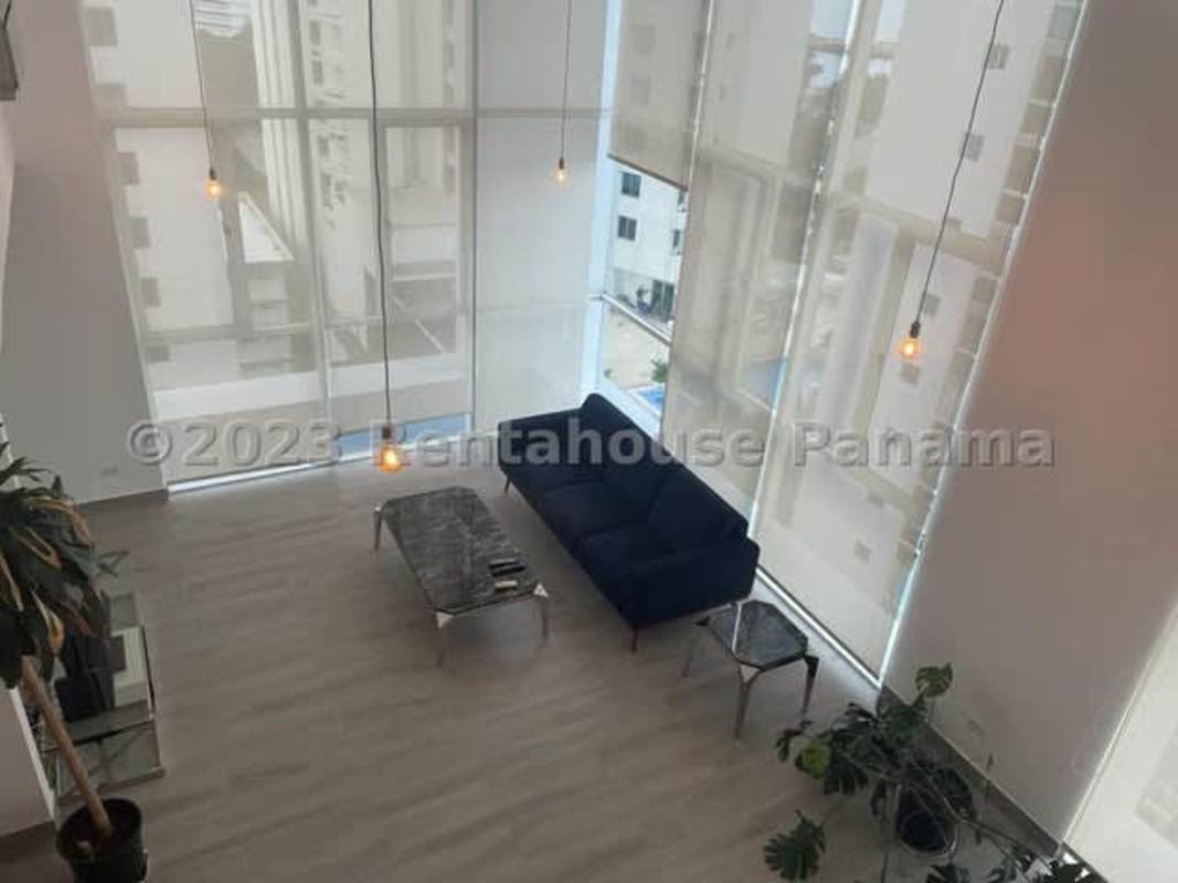 Living and dining area mezzanine view double-height ceiling in PH Blue Park Bella Vista Panama