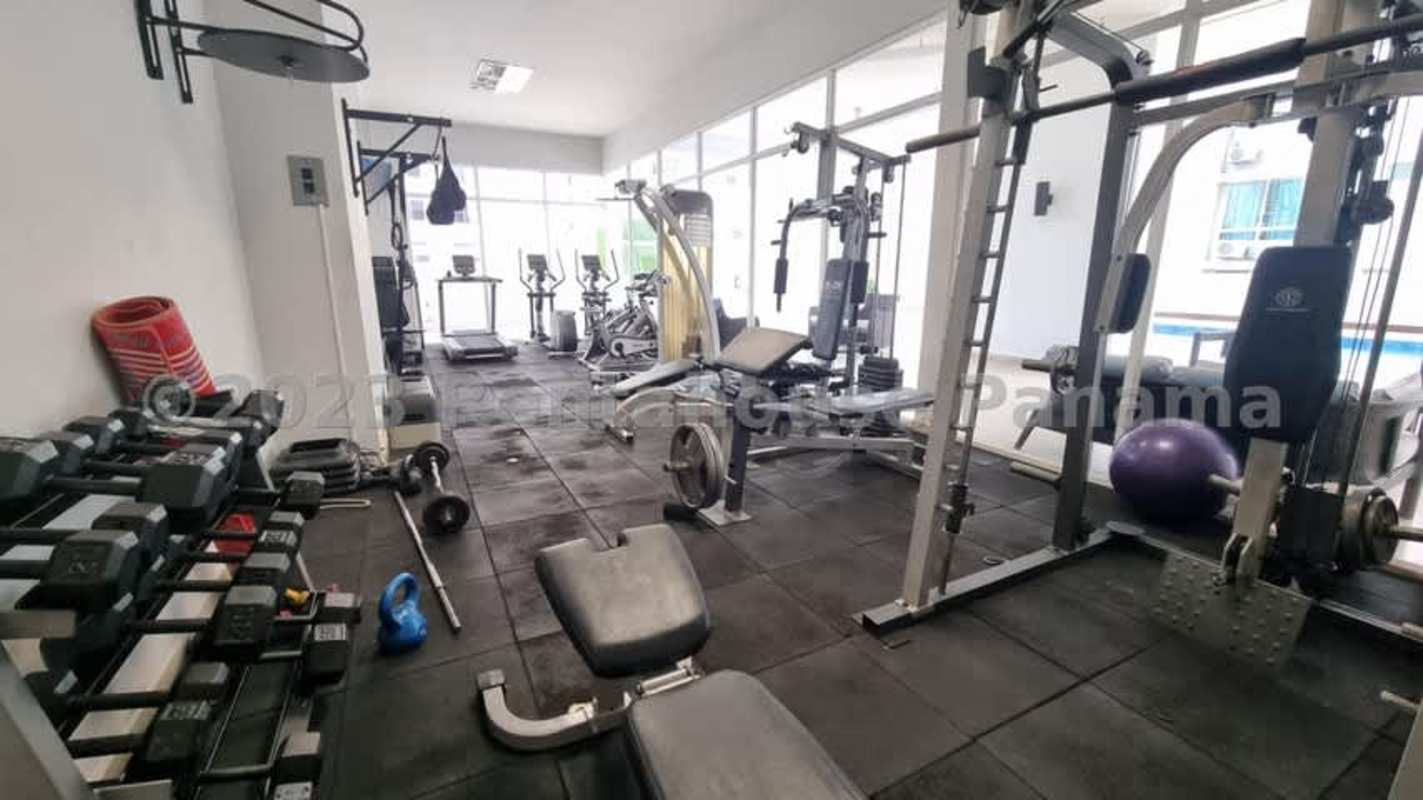Modern gym with cardio equipment weights PH Blue Park Bella Vista Panama