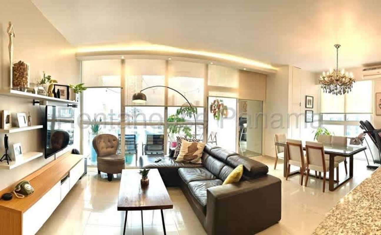 Modern living dining with sectional sofa, chandelier and large windows in PH San Francisco Tower Panama