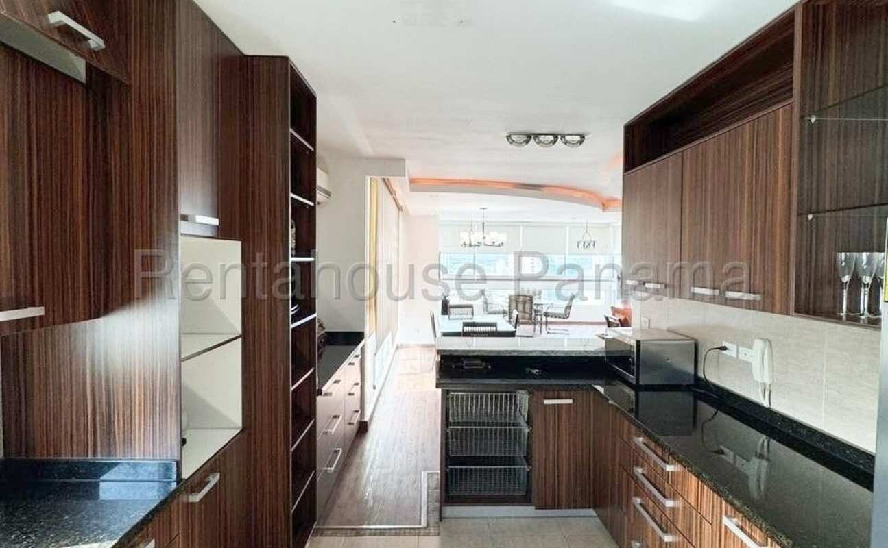 Fully equipped modern kitchen granite countertops stainless appliances The View Panama