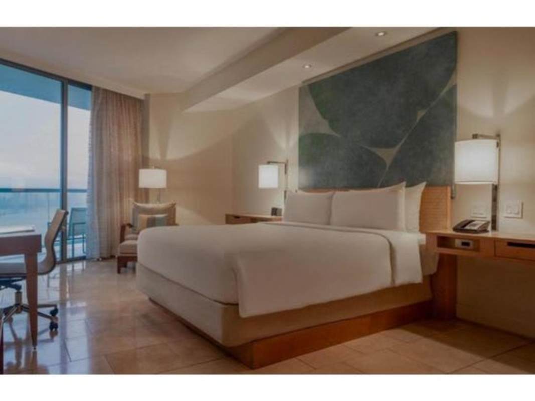 Modern marble bathroom with tub and walk-in shower at JW Marriott Hotel Condo Punta Pacifica Panama City