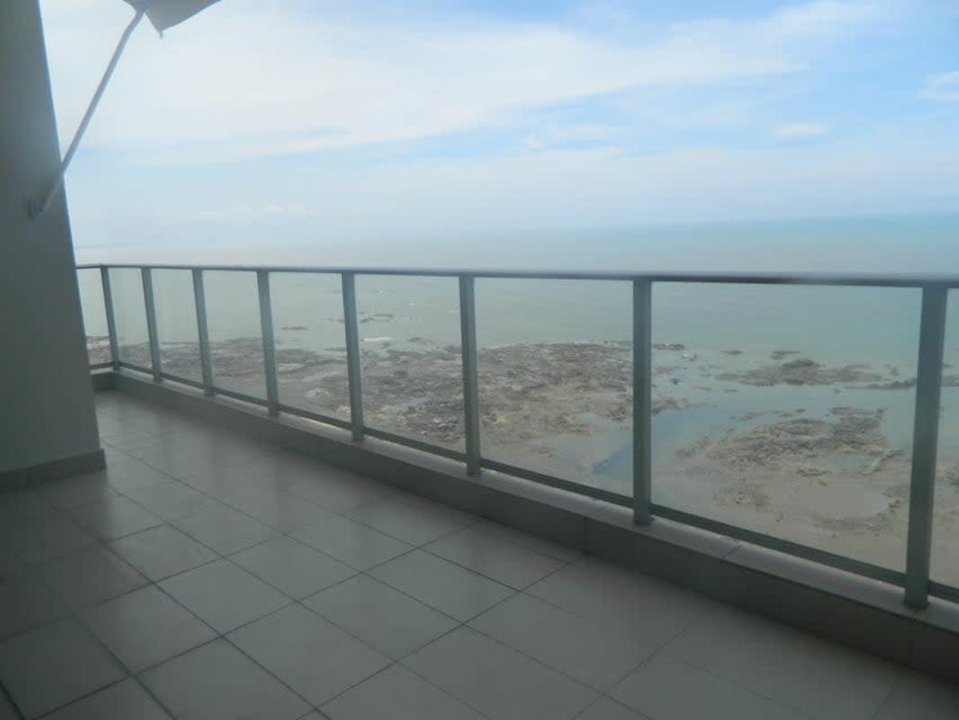 Master bedroom featuring large window and balcony access with Pacific Ocean view in Dupont Tower
