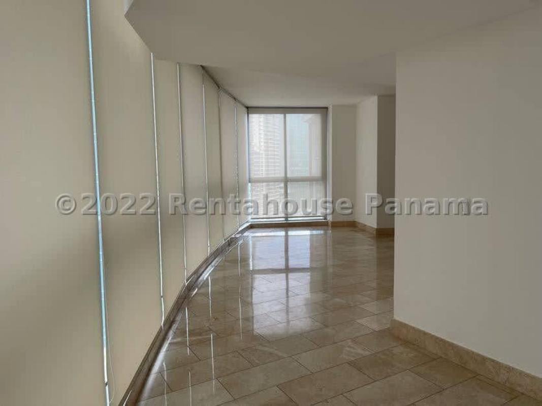 Kitchen with granite countertops, dark cabinetry, ocean view window in PH Grand Tower Punta Pacifica Panama