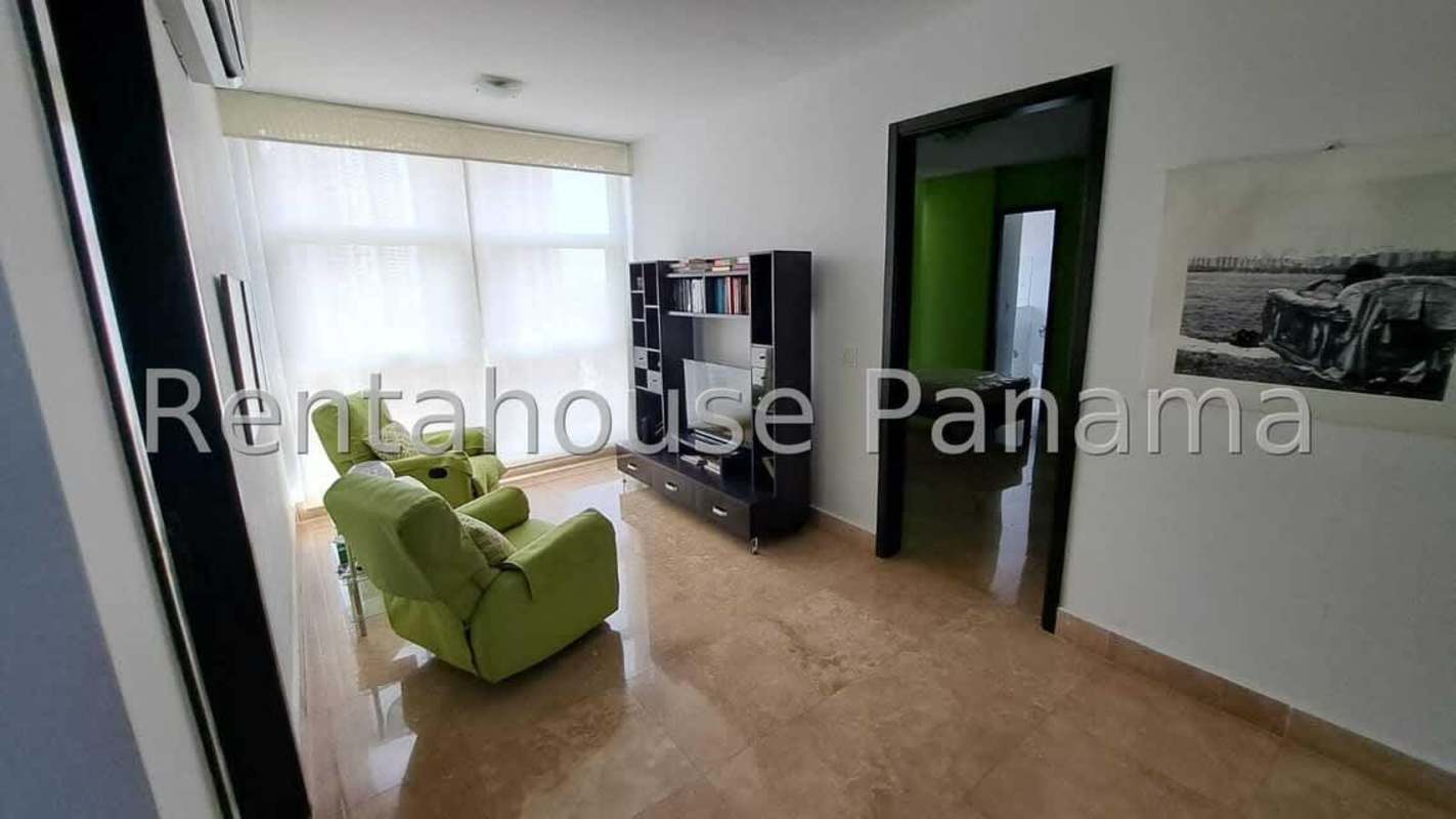 Elegant master bedroom with marble floors, balcony access and Pacific ocean views in Q Tower condo Panama