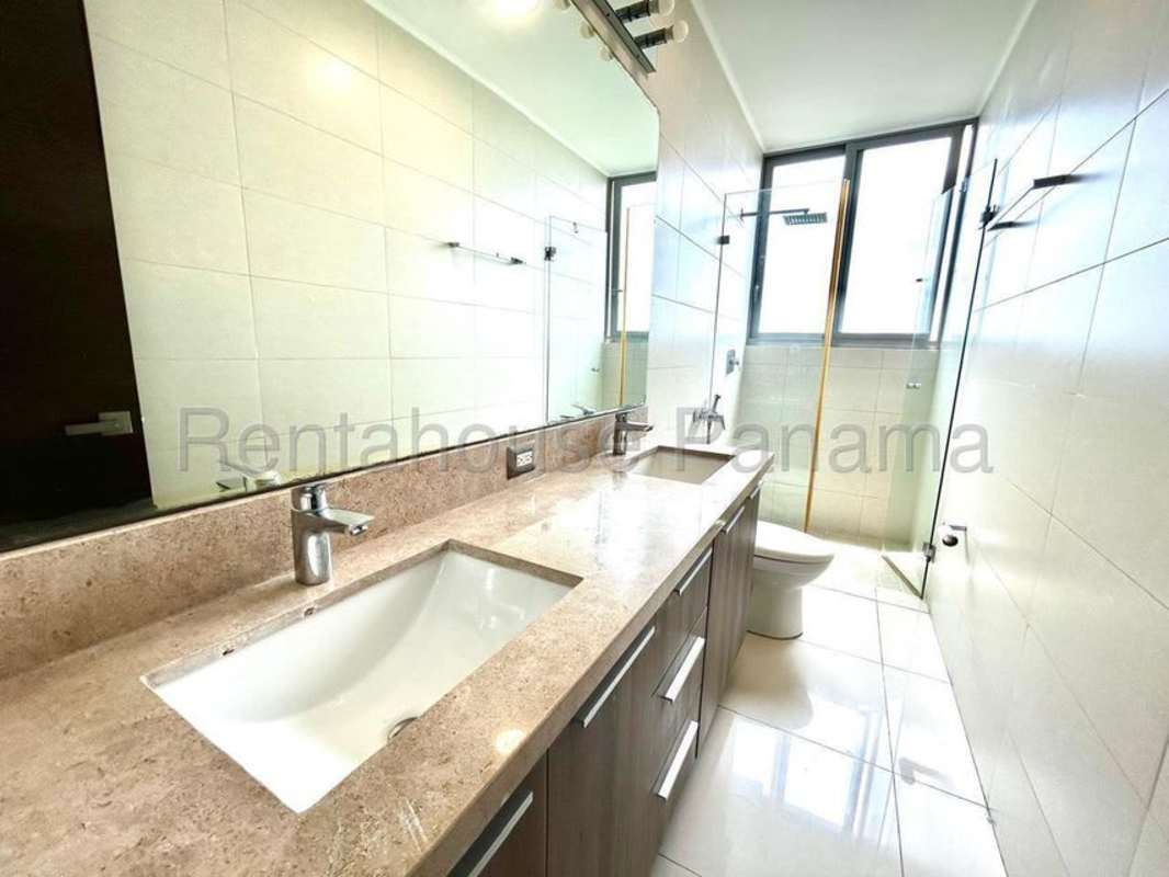 Bathroom with double sink, large mirror, glass shower PH Costa del Mar Costa del Este Panama