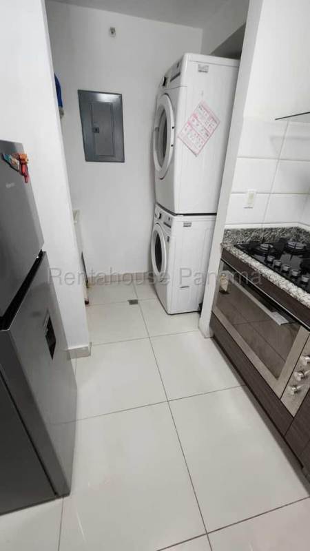 Kitchen with granite countertops, built-in appliances in Carrasquilla Residences Panama City apartment