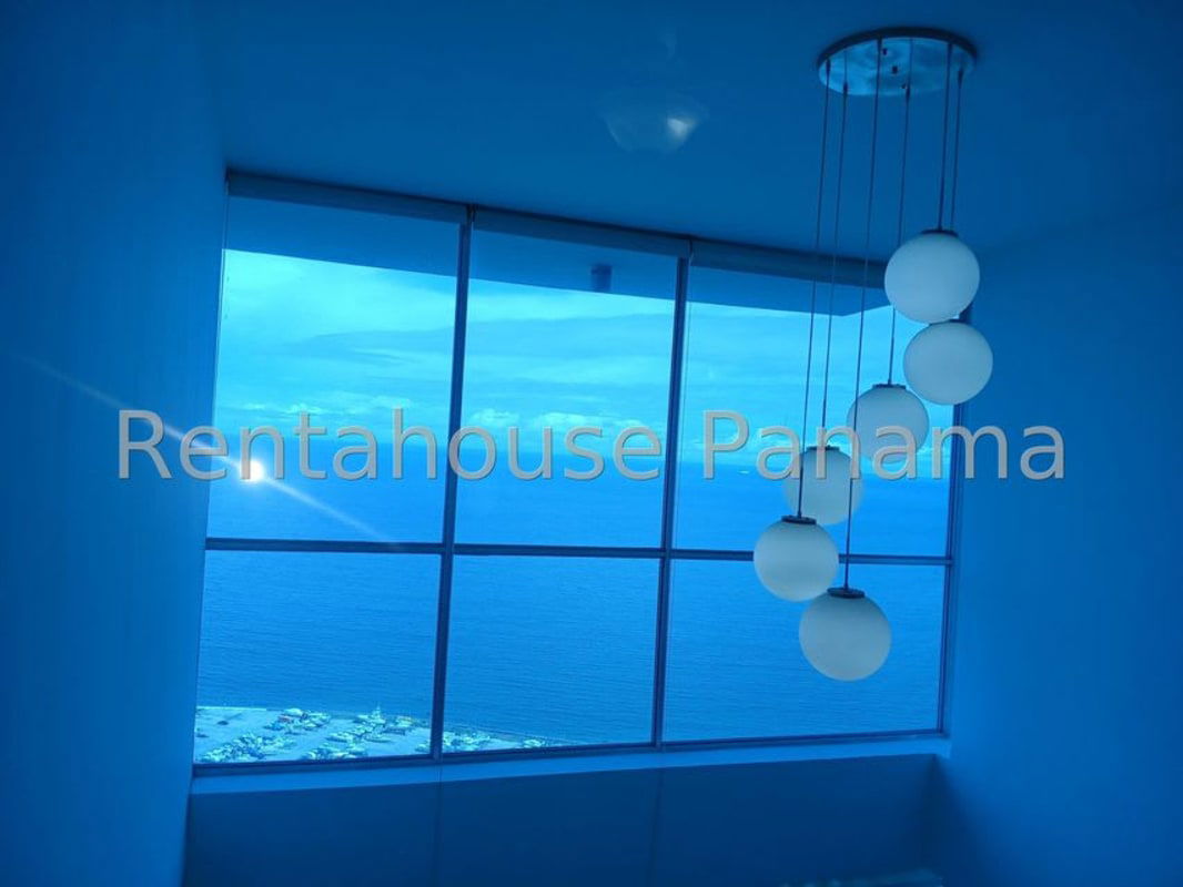 Balcony with glass railing and panoramic ocean view at PH Sky Residences on Avenida Balboa