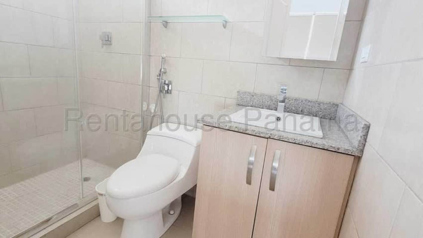 Bathroom with enclosed shower, granite vanity and wall mirror in PH Creta Chanis