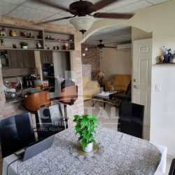 Modern kitchen with granite countertops, built-in stove and upper cabinets Villas de Montelimar Panama