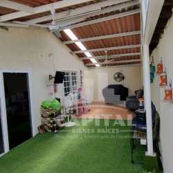 Front exterior view with porch garden and lawn Villas de Montelimar Panama