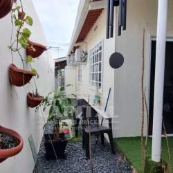 Side yard with plants, gravel, and window view exterior of Panama house for sale