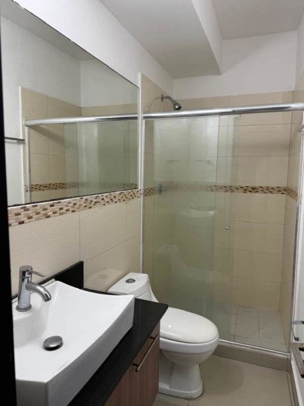 Contemporary bathroom with mosaic tile accent, large mirror, vanity, and glass shower PH San Francisco Bay Panama