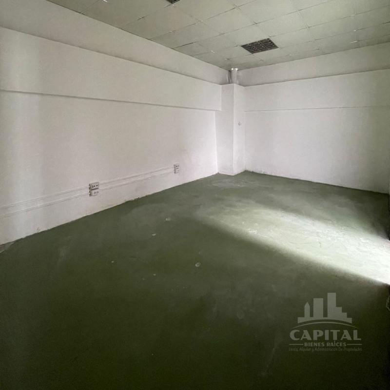 Interior empty office space with windows and tiled floor in warehouse complex Tocumen