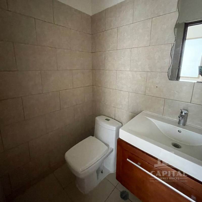 Compact interior utility space with tiled walls plumbing and faucet Tocumen warehouse