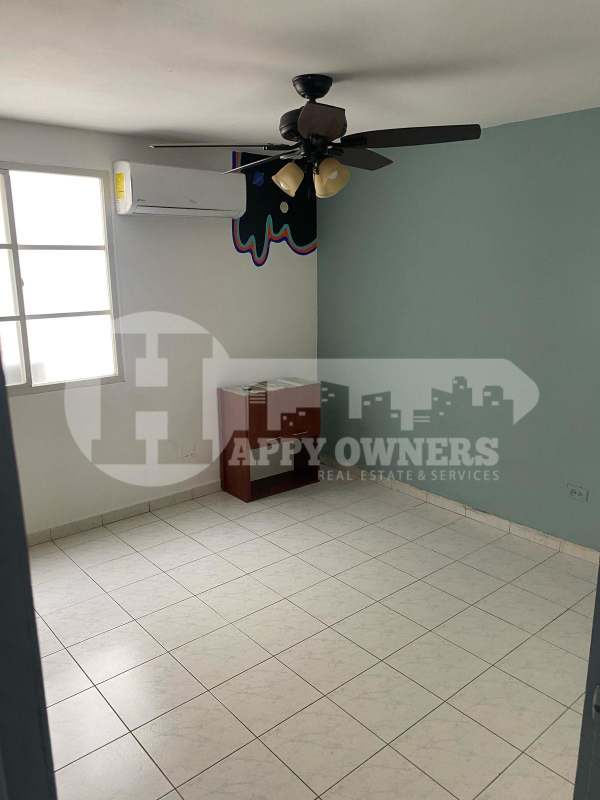 Bright bedroom with AC, fan, blue accent wall in PH Lomas Carrasquilla Panama City