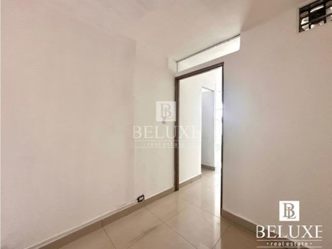 Partitioned office rooms with white walls and tile floors in PH Albrook Point commercial property