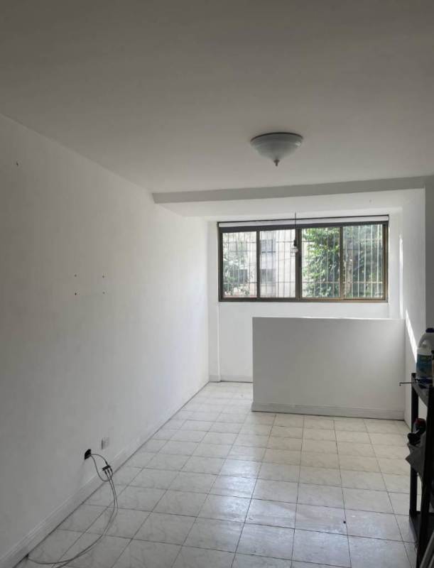 Bright living room with tile floors and large window Campe Alegre Bella Vista Panama