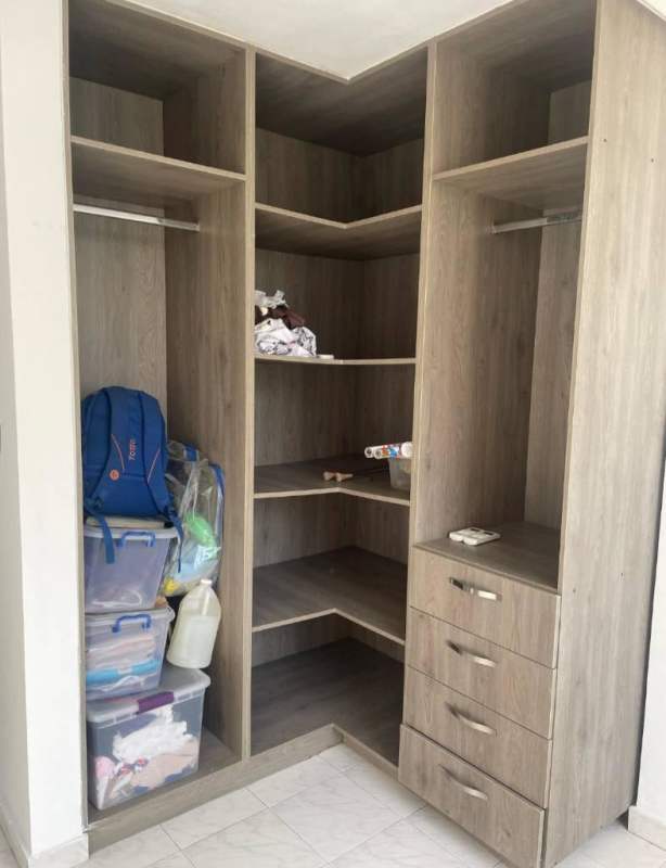 Minimalist bedroom with natural light, tile floors and glass privacy window in PH Bellavista Tower Panama