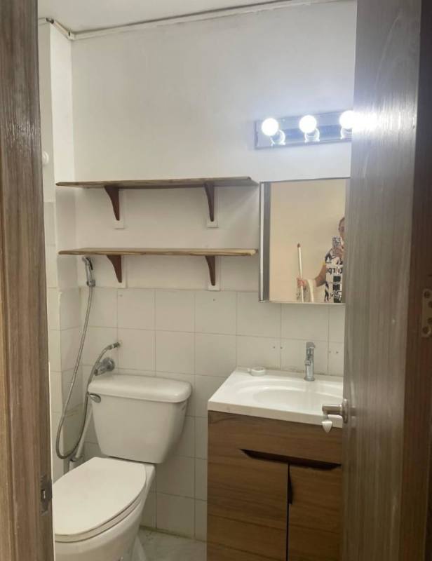 Small bathroom with sink, mirror, and white tiles PH Bellavista Tower Panama City for rent