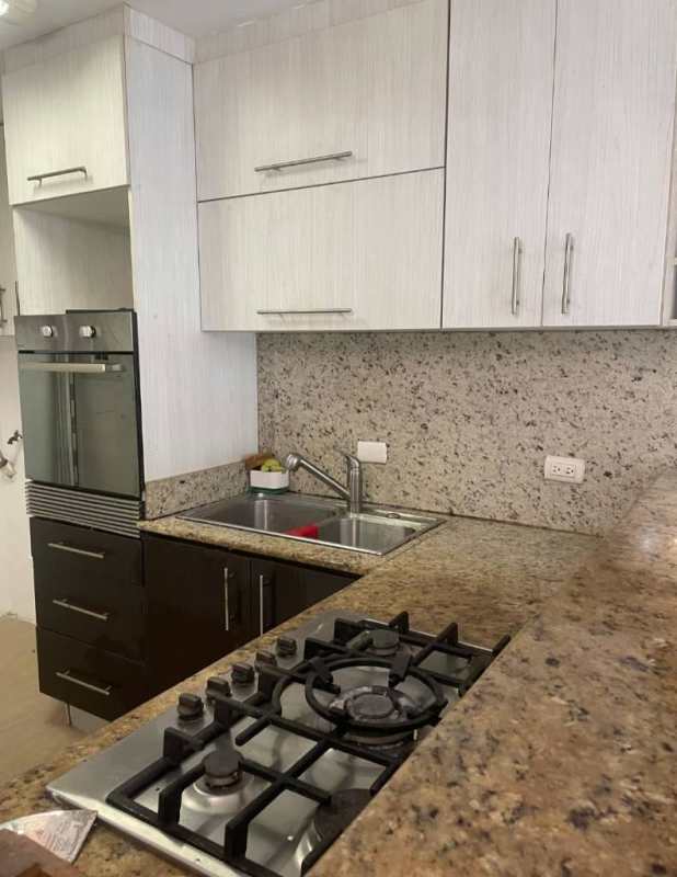 Modern kitchen with granite counter and cabinets in Bellavista Tower Panama rental