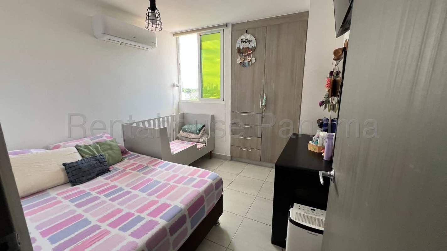 Bedroom featuring large window overlooking Panama City at PH Metropolitan Park Vía España Obarrio