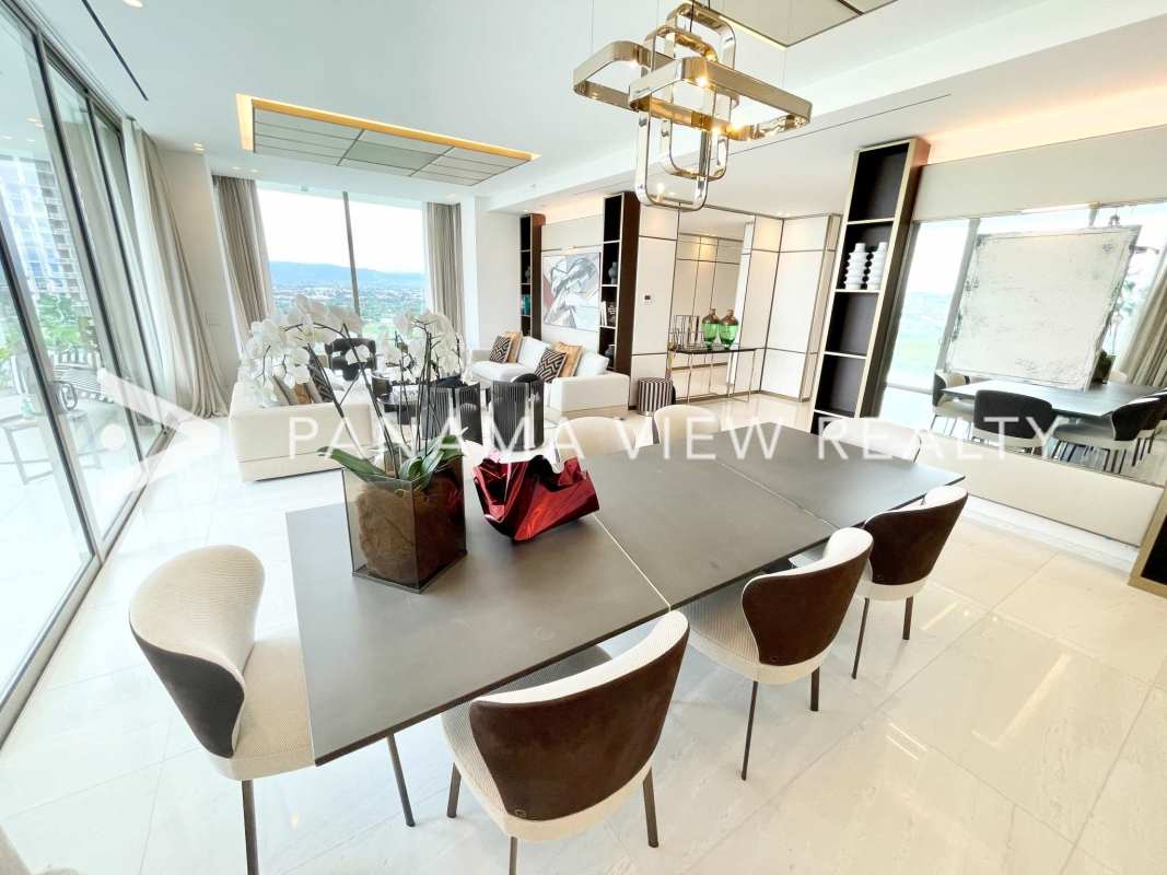 Spacious open-plan living dining room with floor-to-ceiling windows in La Maison by Fendi Panama