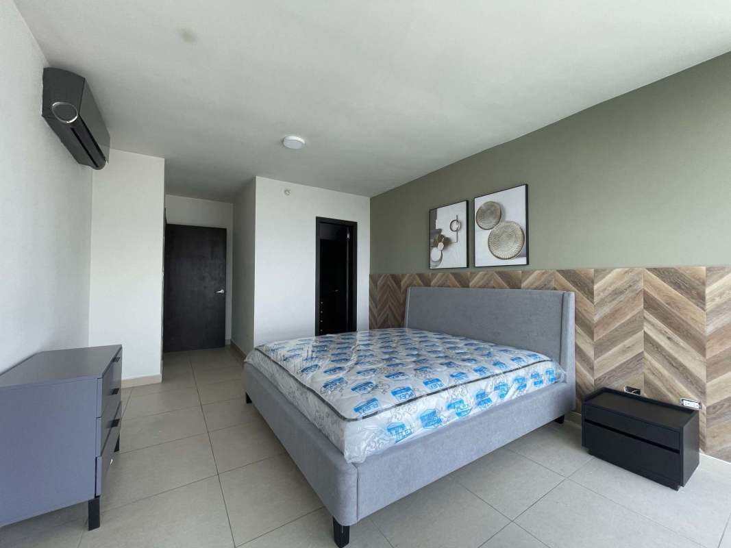 Spacious bedroom with accent wall, large windows, AC, modern furnishings in Country Club Costa del Este Panama