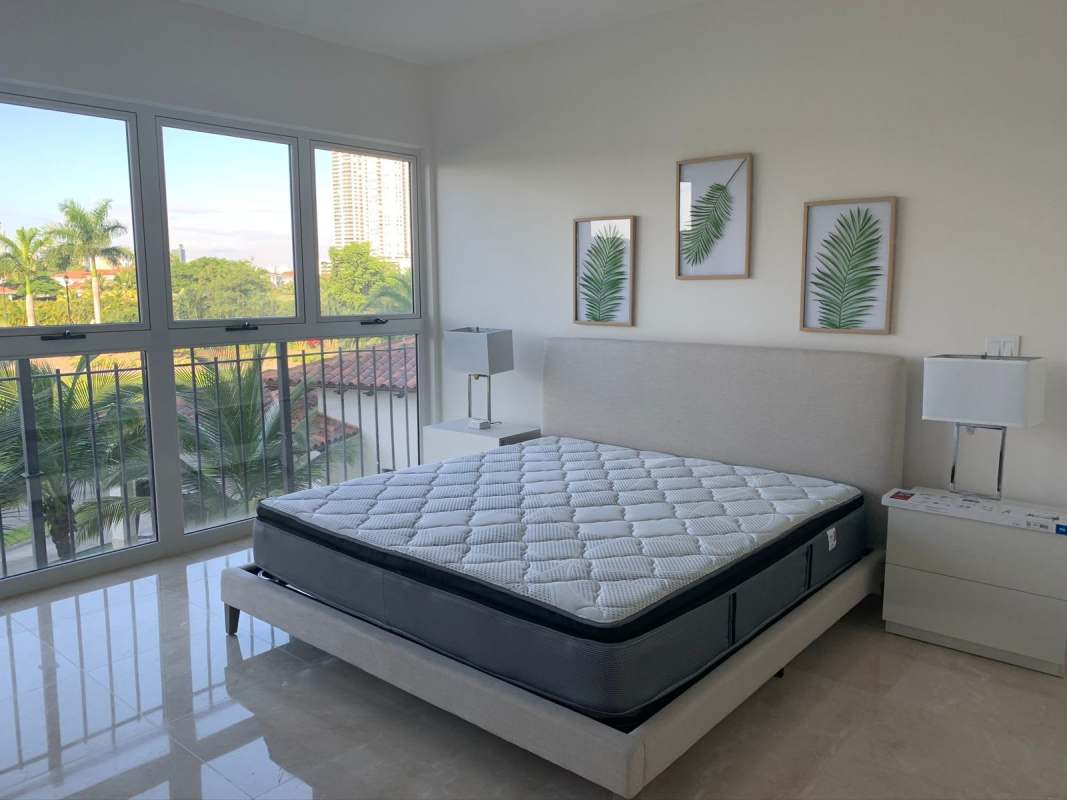 Luxury bathroom with double sink, marble countertop, large mirror and decorative vase at PH Ocean House Santa Maria Panama