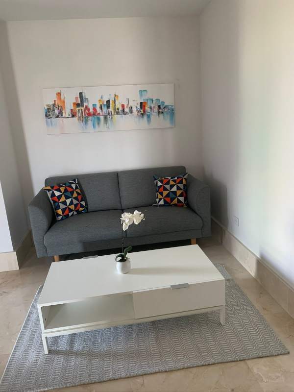 Modern bedroom with large windows, natural light and city view at PH Ocean House Santa Maria Panama