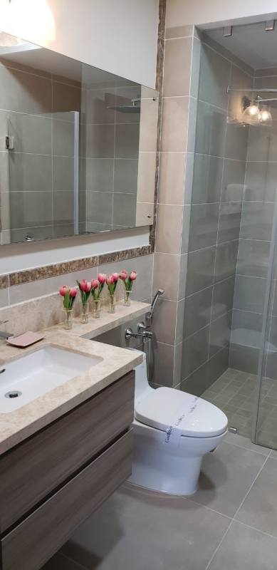 Contemporary dining with glass table and panoramic balcony view at PH Ocean House Santa Maria Panama