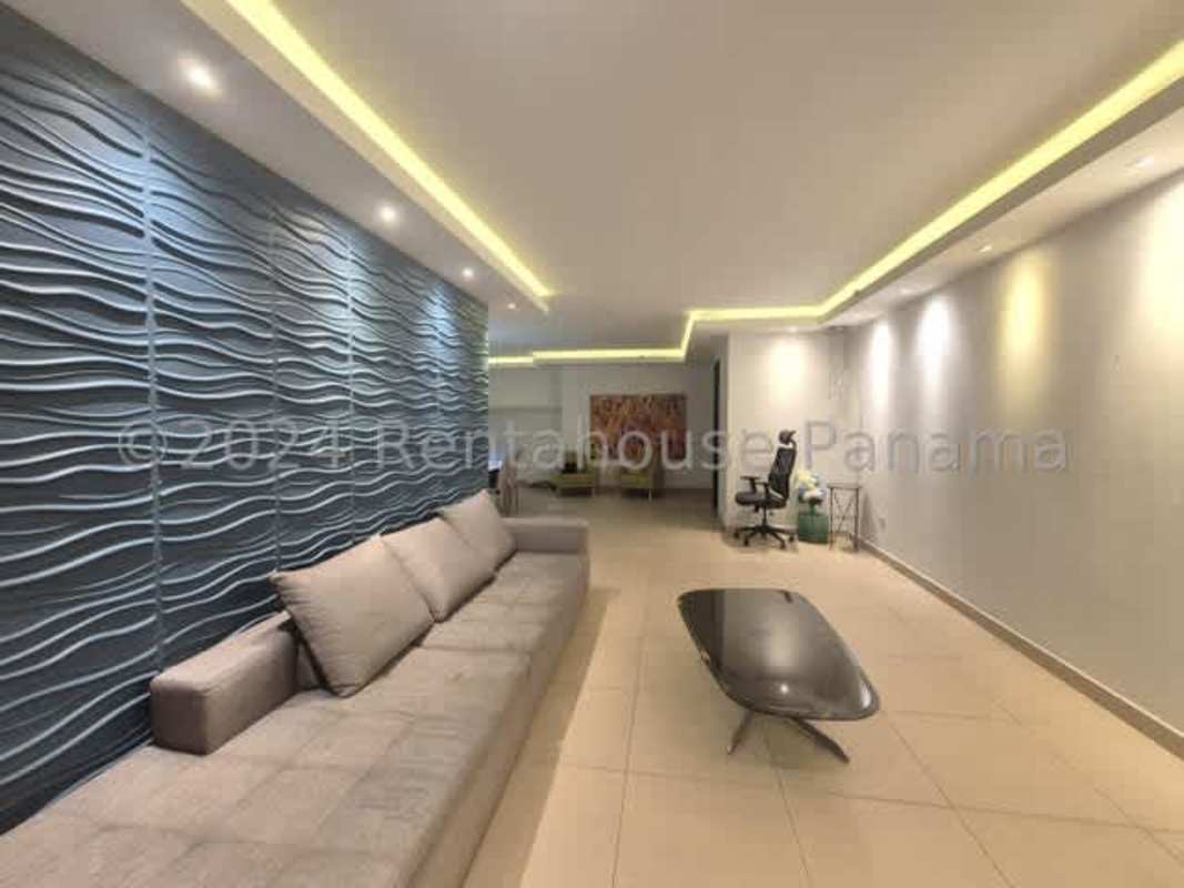 Modern living room with large windows, ocean and skyline views in PH Costa del Este Country Club Panama